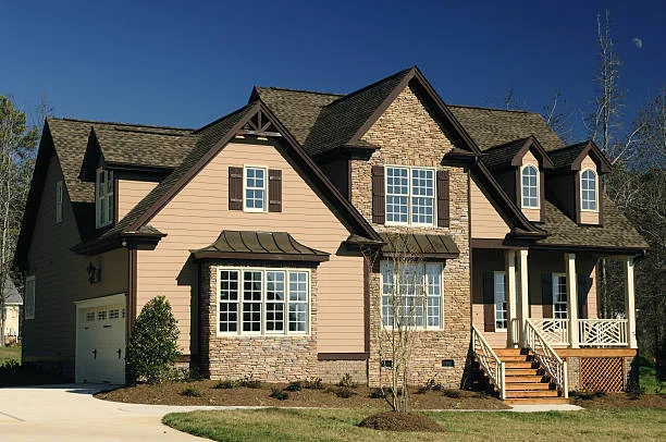 roofers applying an emergency roof patch on a Marietta home after a storm