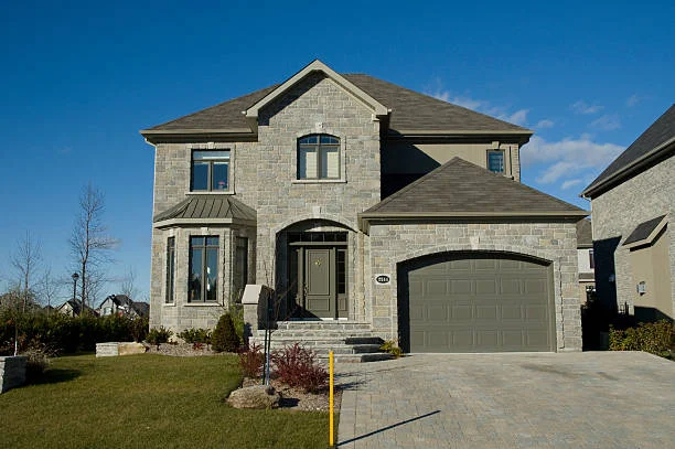 good looking house with a good looking roof after new roof materials have been installed by a professional crew in Georgia